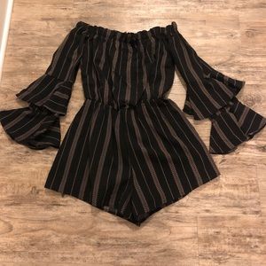 Black romper with gold detail